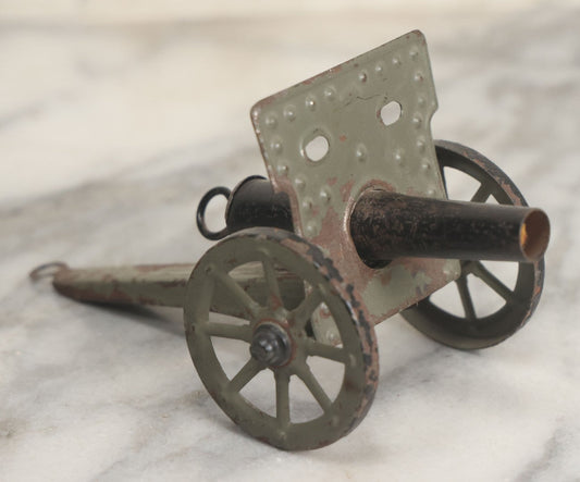 Lot 135 - Vintage Green And Black Painted Tin Toy Cannon With Wheels 