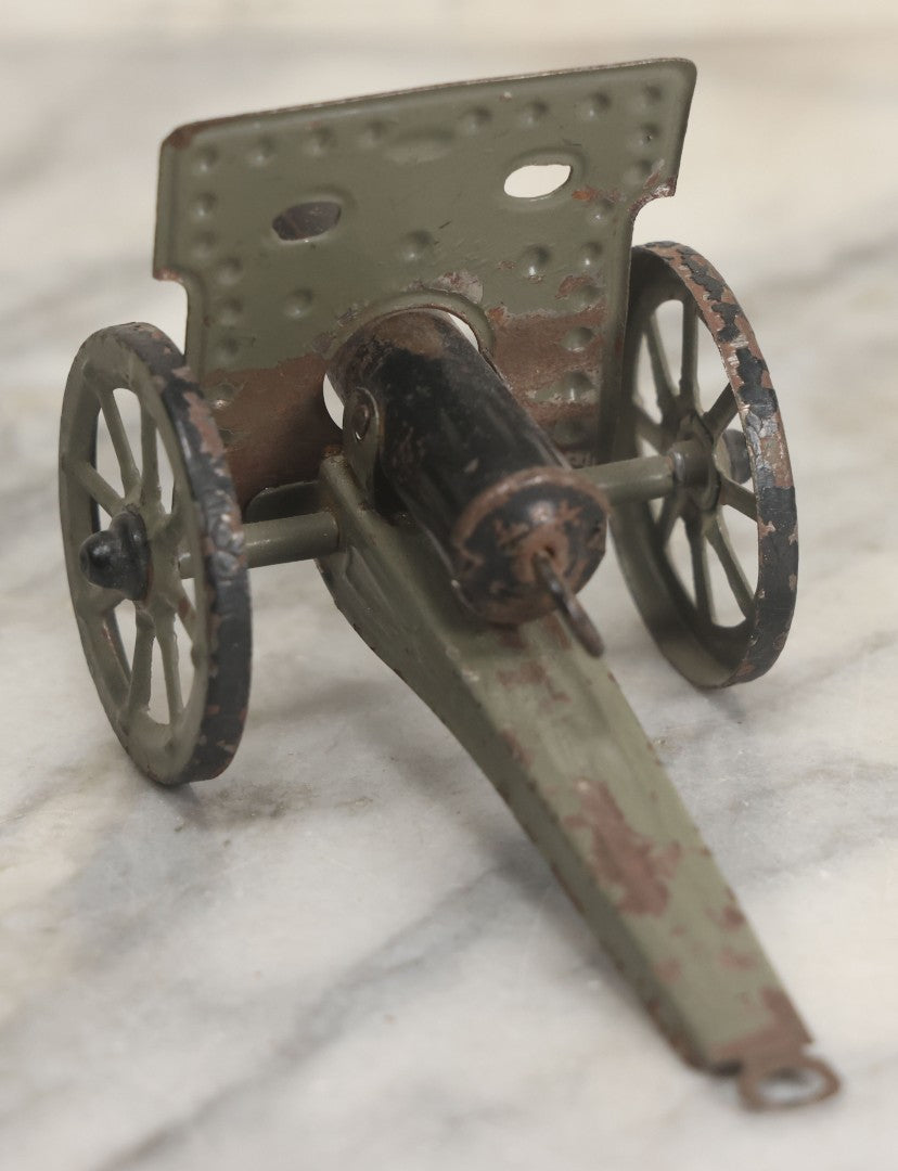 Lot 135 - Vintage Green And Black Painted Tin Toy Cannon With Wheels 