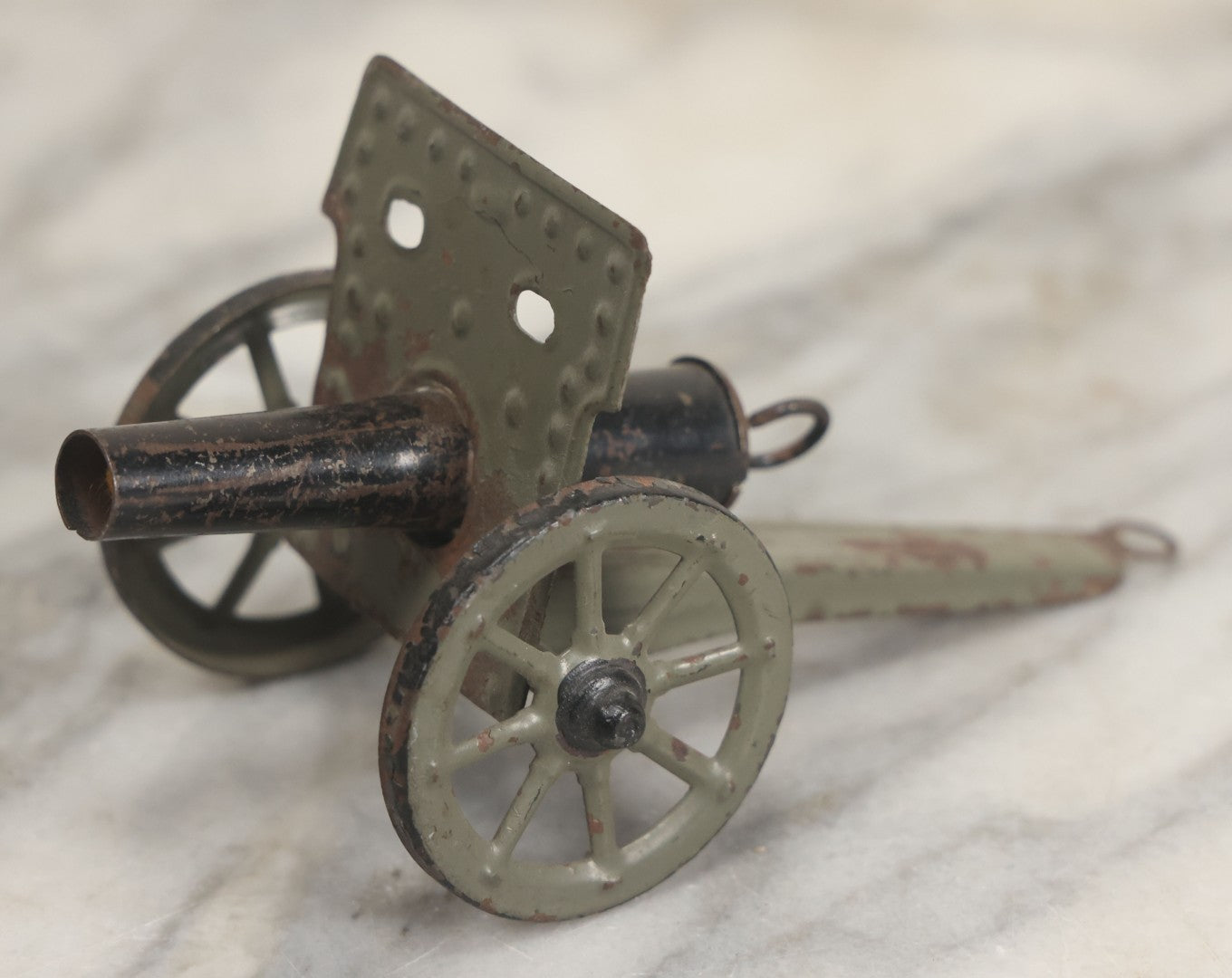 Lot 135 - Vintage Green And Black Painted Tin Toy Cannon With Wheels 