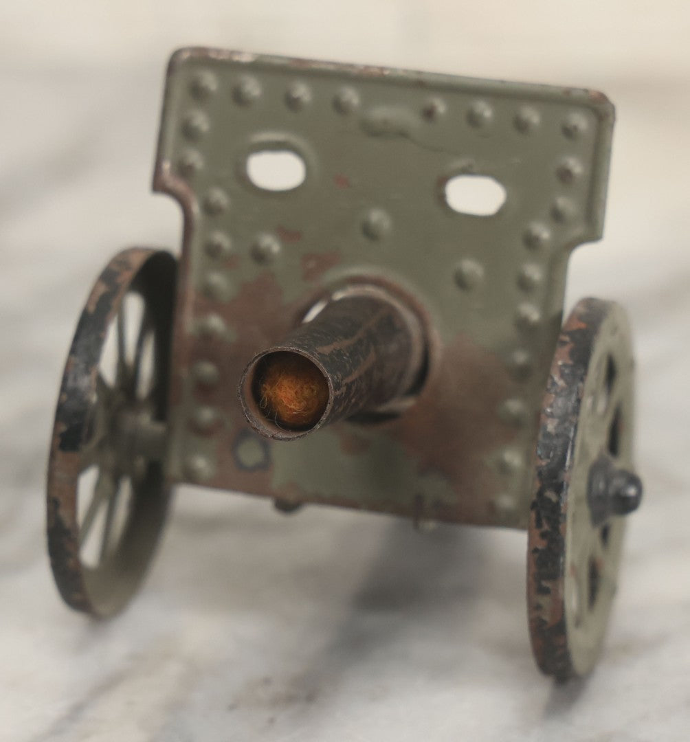 Lot 135 - Vintage Green And Black Painted Tin Toy Cannon With Wheels 