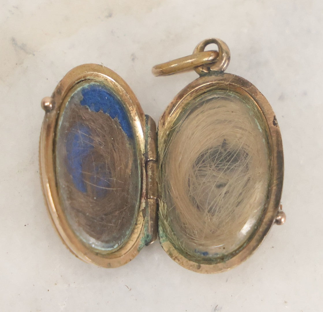 Lot 007 - Antique Victorian Gold Toned Locket With Engraved And Painted Daisies And Blond And Brown Hair Mementos Inside Behind Beveled Glass Windows