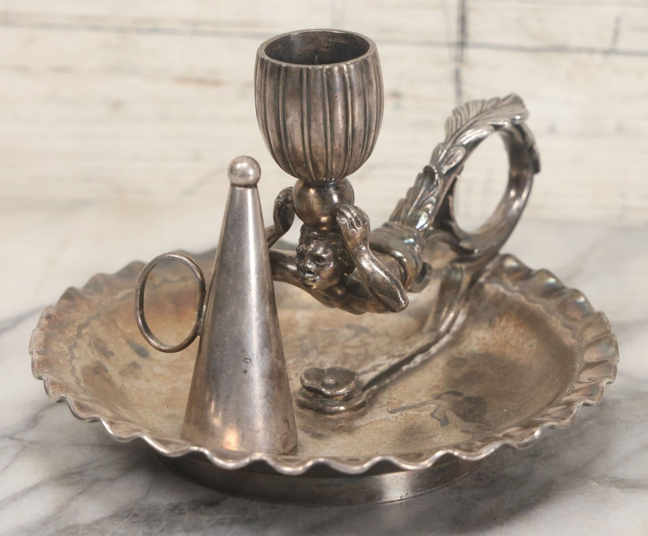 Lot 008 - Antique Silverplate Figural Candle Stand With Genie Motif, Manufactured By Wilcox Silverplate, No. 2731, Meriden, Connecticut, With Original Candle Snuffer