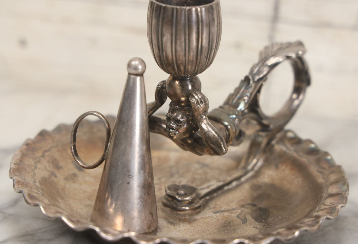 Lot 008 - Antique Silverplate Figural Candle Stand With Genie Motif, Manufactured By Wilcox Silverplate, No. 2731, Meriden, Connecticut, With Original Candle Snuffer