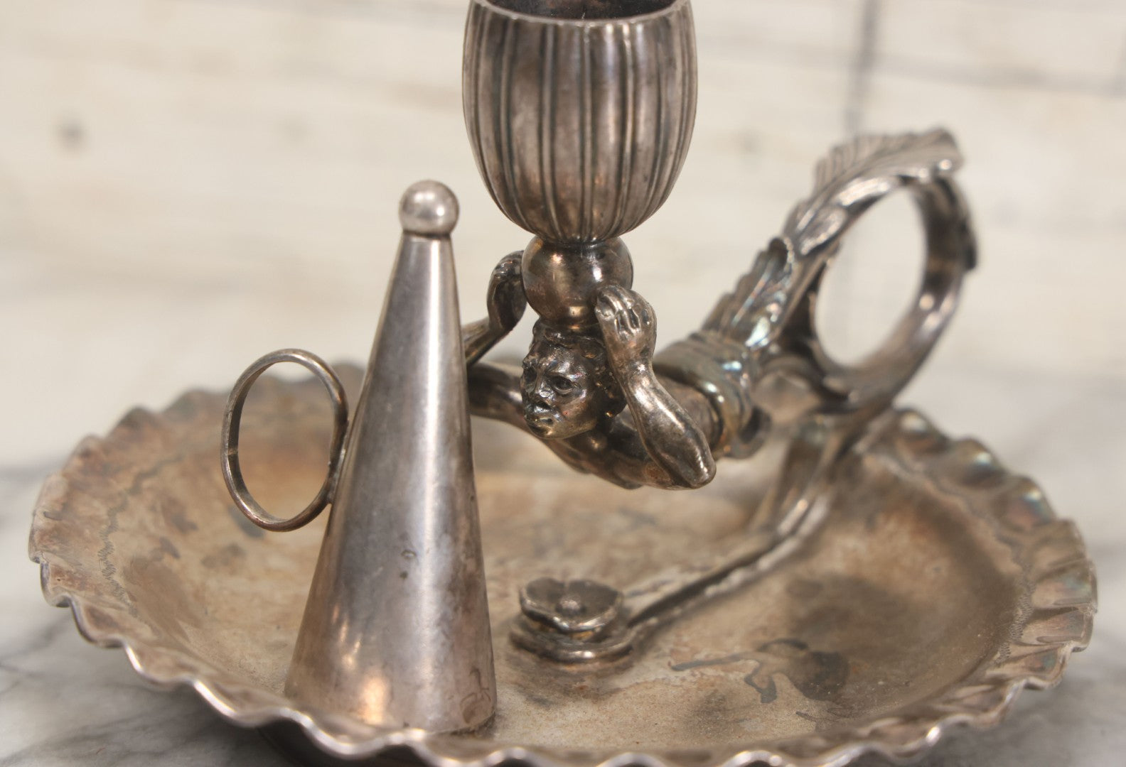 Lot 008 - Antique Silverplate Figural Candle Stand With Genie Motif, Manufactured By Wilcox Silverplate, No. 2731, Meriden, Connecticut, With Original Candle Snuffer