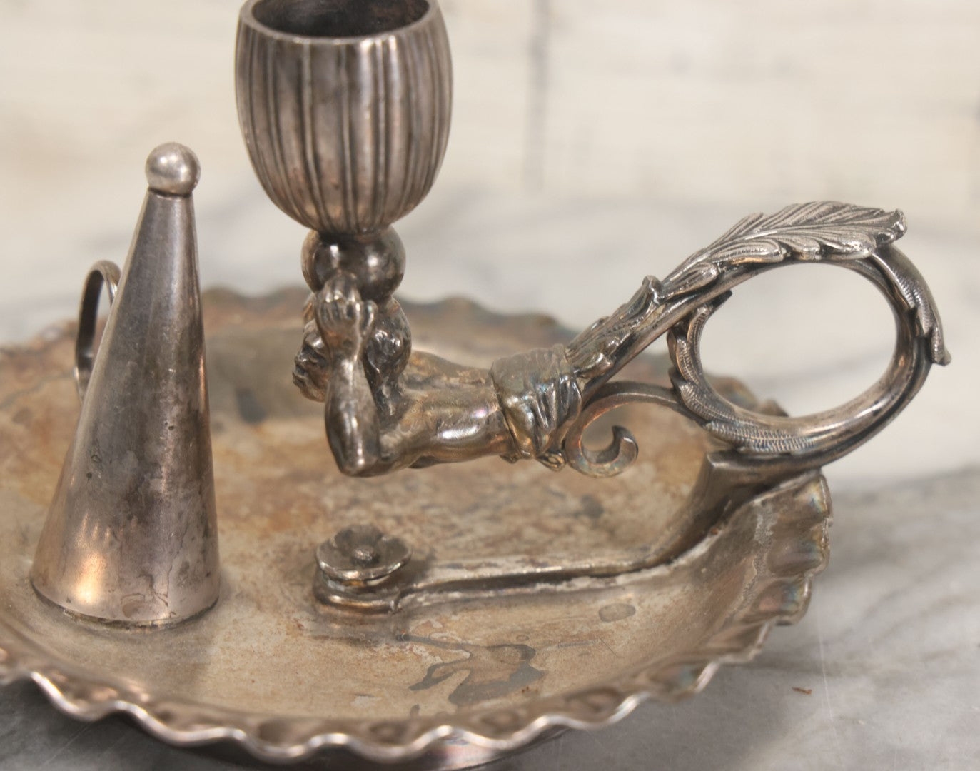 Lot 008 - Antique Silverplate Figural Candle Stand With Genie Motif, Manufactured By Wilcox Silverplate, No. 2731, Meriden, Connecticut, With Original Candle Snuffer
