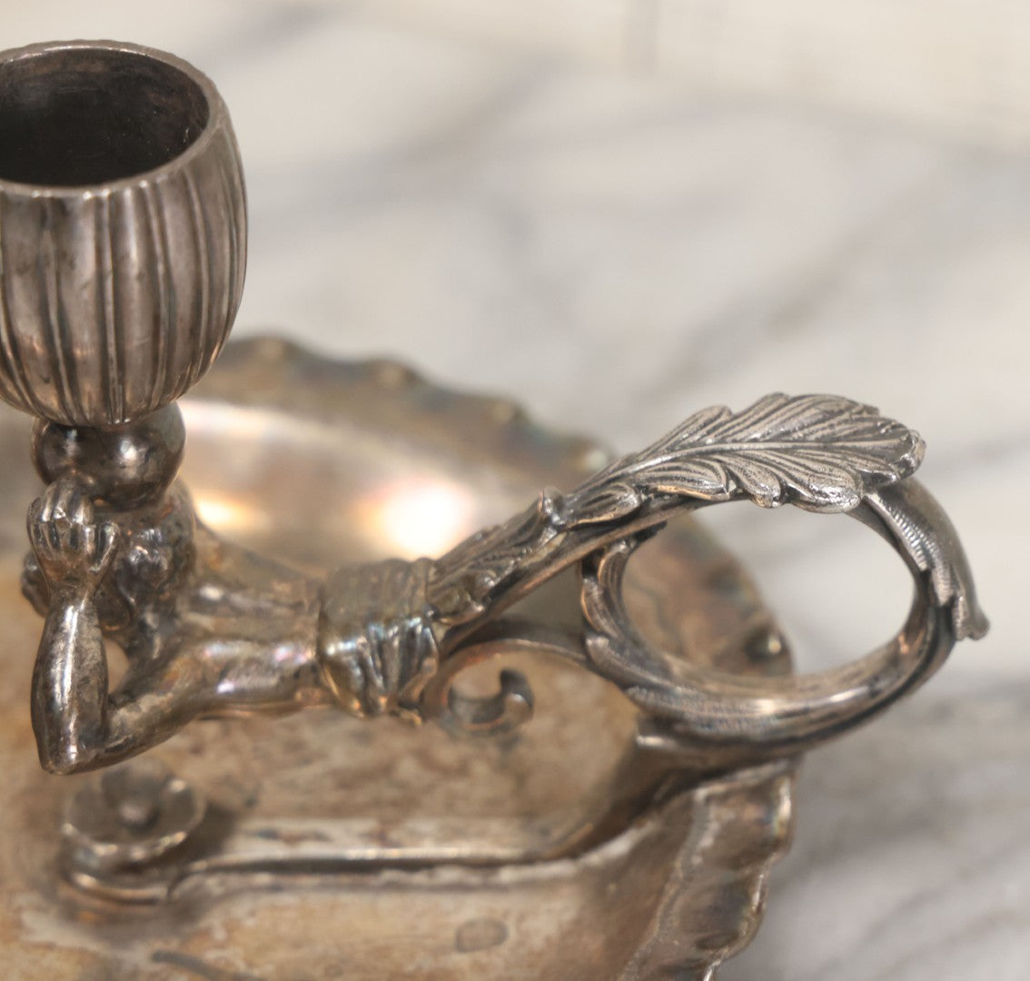 Lot 008 - Antique Silverplate Figural Candle Stand With Genie Motif, Manufactured By Wilcox Silverplate, No. 2731, Meriden, Connecticut, With Original Candle Snuffer