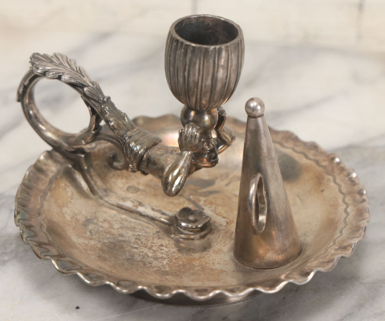 Lot 008 - Antique Silverplate Figural Candle Stand With Genie Motif, Manufactured By Wilcox Silverplate, No. 2731, Meriden, Connecticut, With Original Candle Snuffer