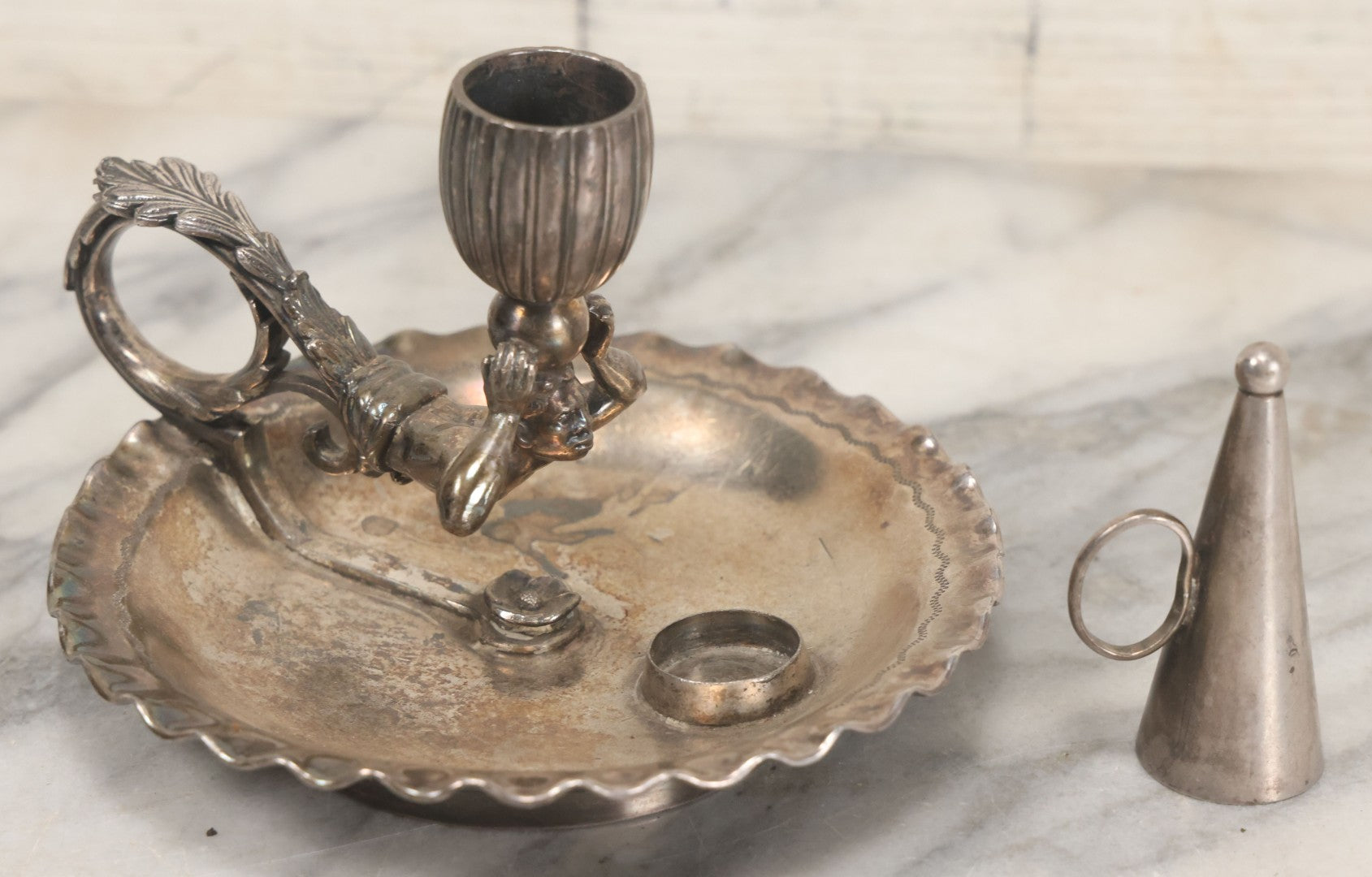 Lot 008 - Antique Silverplate Figural Candle Stand With Genie Motif, Manufactured By Wilcox Silverplate, No. 2731, Meriden, Connecticut, With Original Candle Snuffer