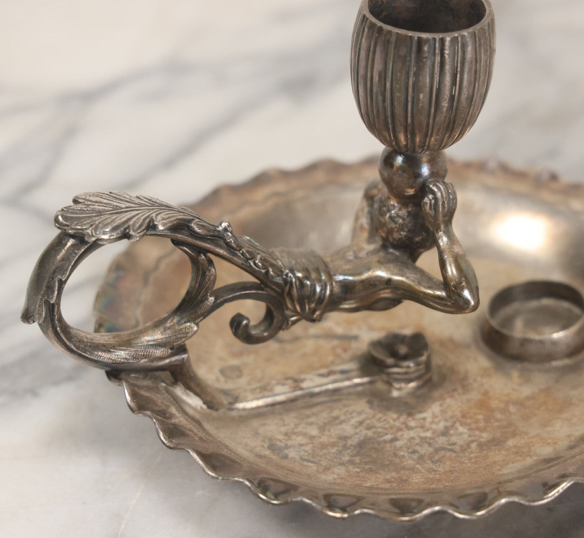 Lot 008 - Antique Silverplate Figural Candle Stand With Genie Motif, Manufactured By Wilcox Silverplate, No. 2731, Meriden, Connecticut, With Original Candle Snuffer