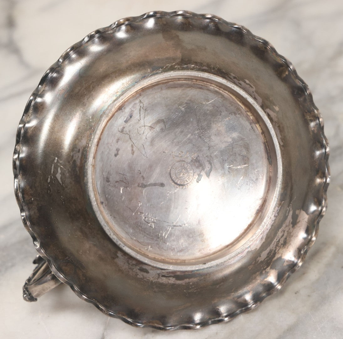 Lot 008 - Antique Silverplate Figural Candle Stand With Genie Motif, Manufactured By Wilcox Silverplate, No. 2731, Meriden, Connecticut, With Original Candle Snuffer