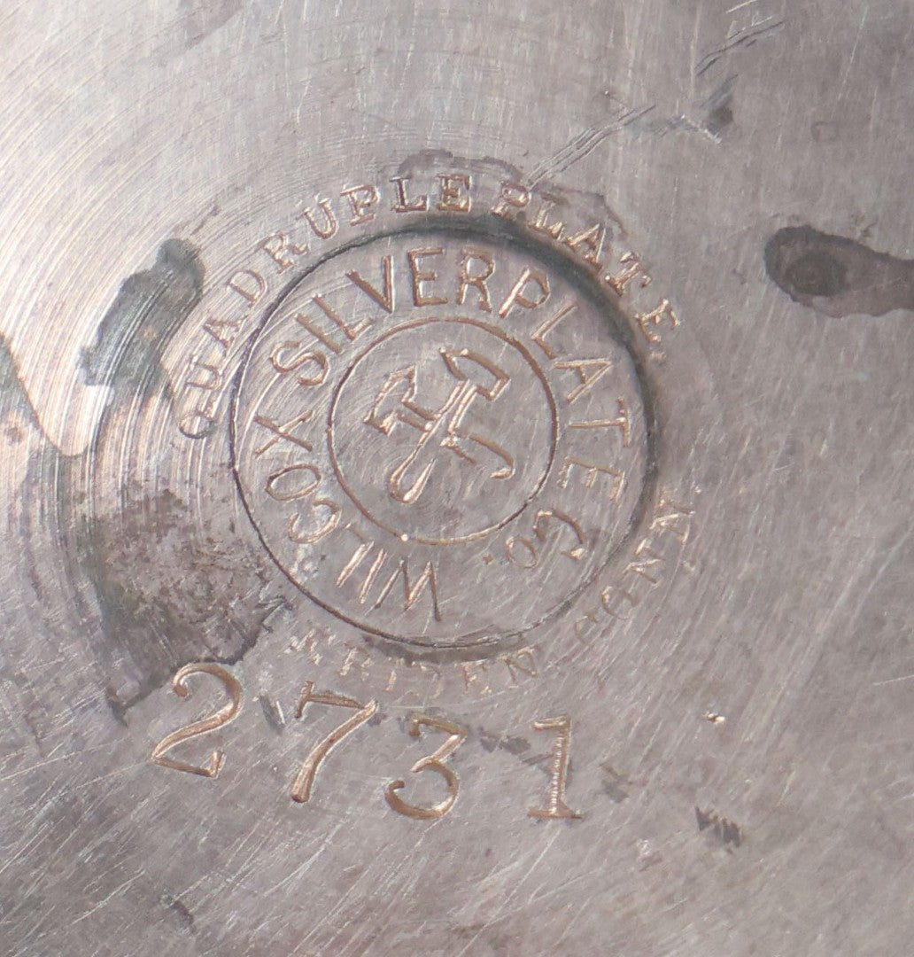 Lot 008 - Antique Silverplate Figural Candle Stand With Genie Motif, Manufactured By Wilcox Silverplate, No. 2731, Meriden, Connecticut, With Original Candle Snuffer