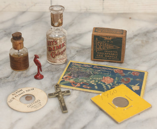Lot 165 - Eight Piece Vintage Smalls Grouping Including Hoyt's Dime Cologne Bottle, Nixon New Penny Novelty, Ebony And Metal Crucifix, And Other Items