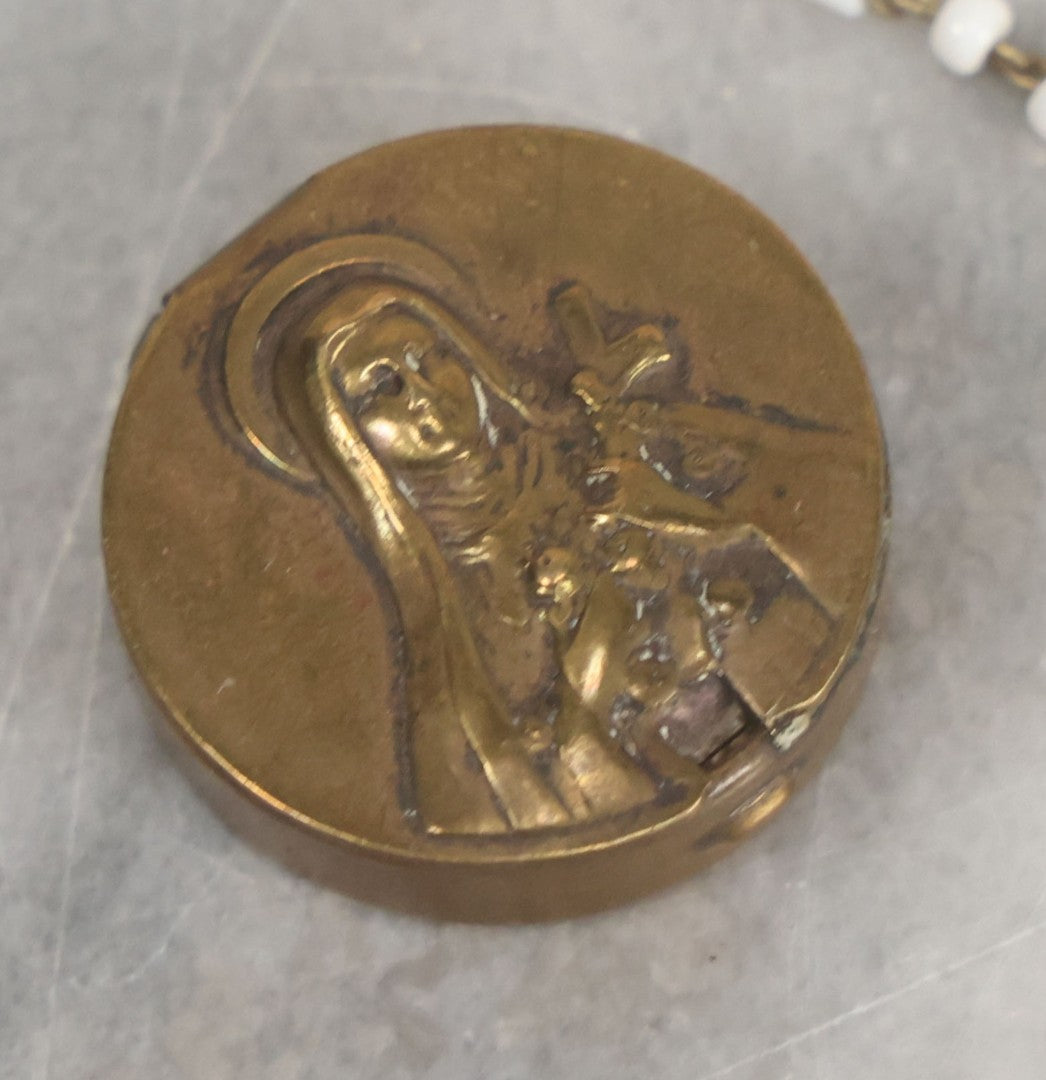 Lot 016 - Vintage Miniature White And Red Glass Rosary Beads With Crucifix In Button Sized Metal Carrying Case With Embossed Saint Therese