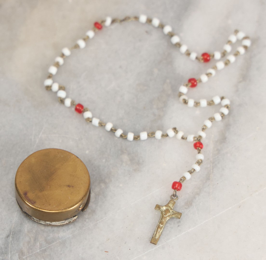 Lot 016 - Vintage Miniature White And Red Glass Rosary Beads With Crucifix In Button Sized Metal Carrying Case With Embossed Saint Therese