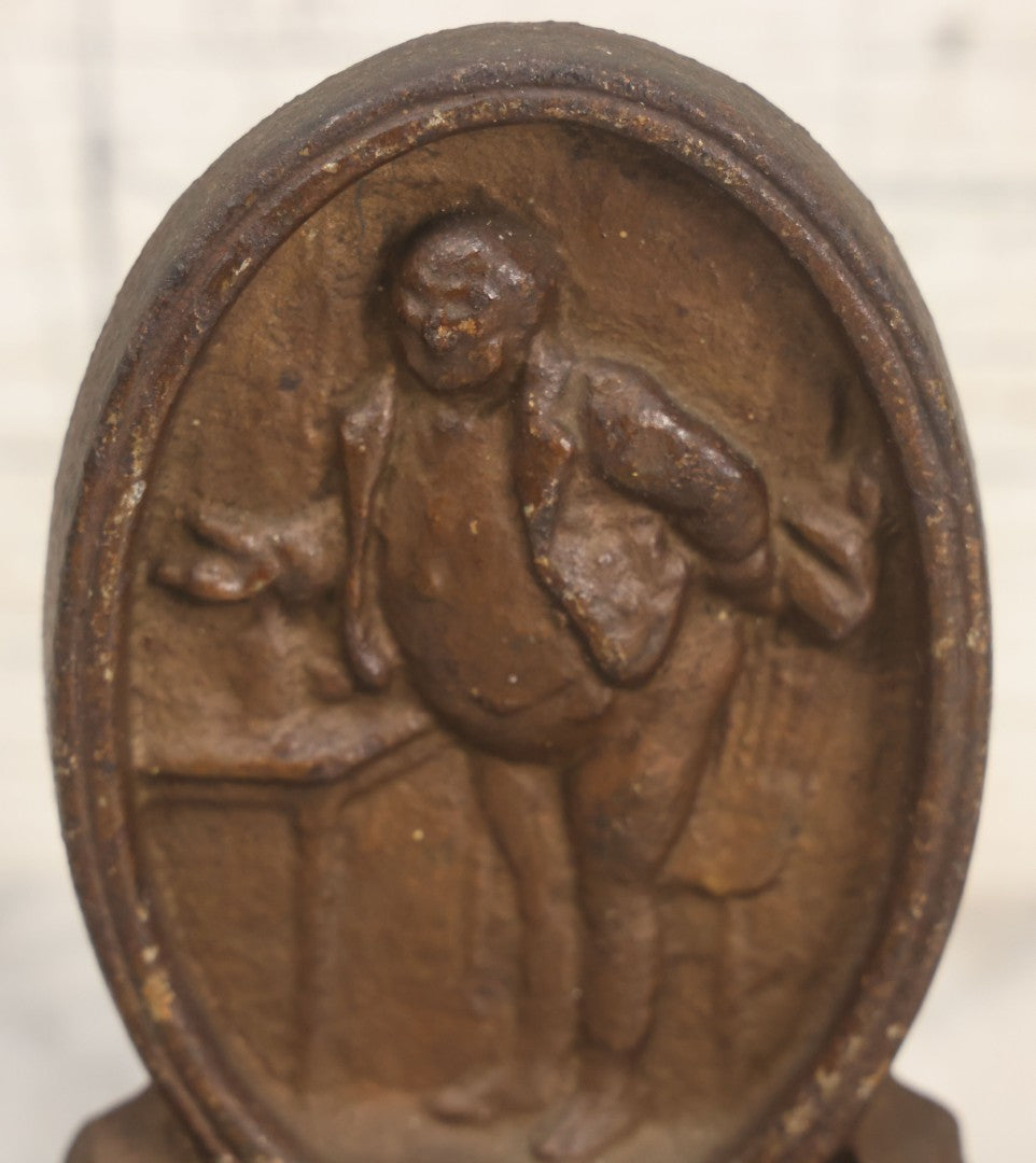 Lot 020 - Antique Cast Iron Bookends Featuring Portly Business Man In Suit With Handout
