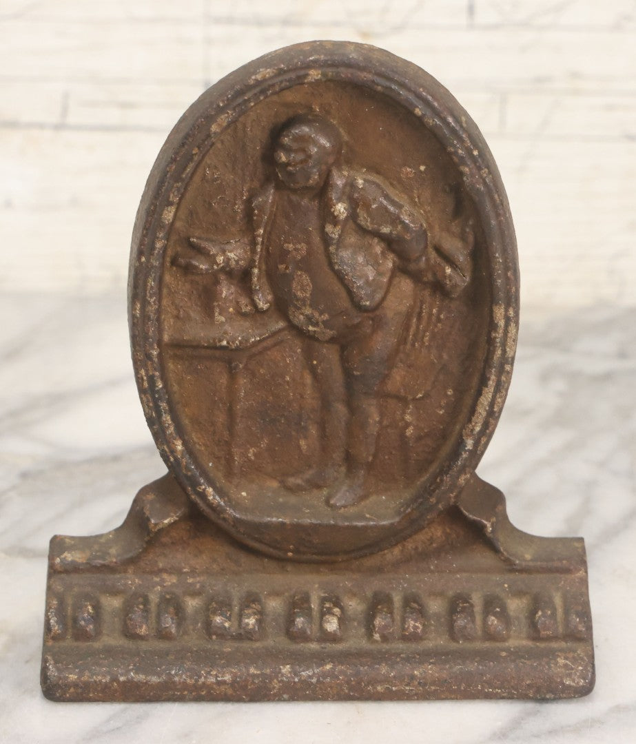 Lot 020 - Antique Cast Iron Bookends Featuring Portly Business Man In Suit With Handout