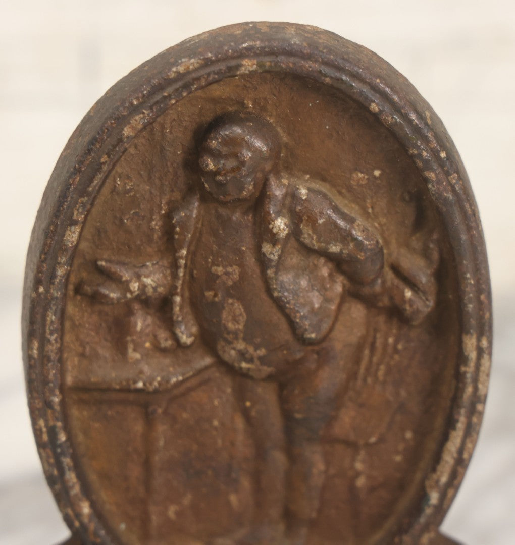 Lot 020 - Antique Cast Iron Bookends Featuring Portly Business Man In Suit With Handout