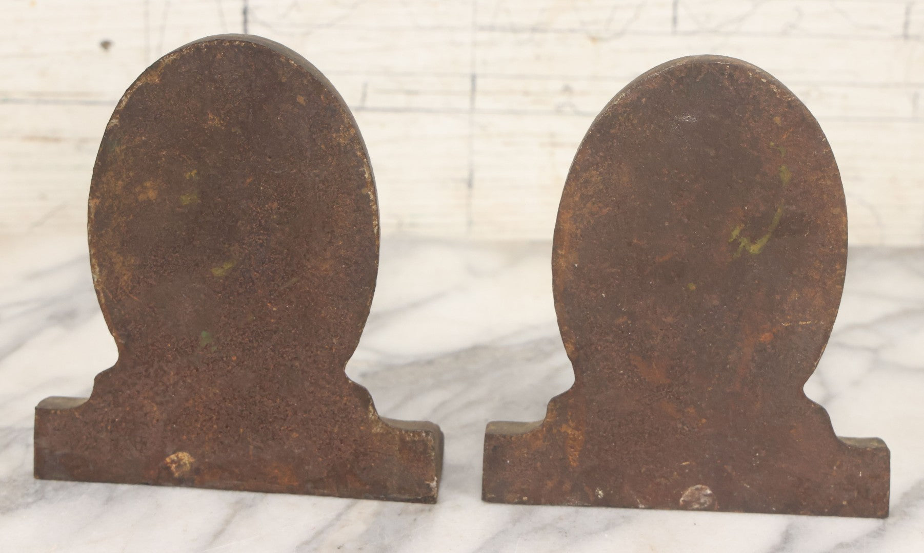 Lot 020 - Antique Cast Iron Bookends Featuring Portly Business Man In Suit With Handout