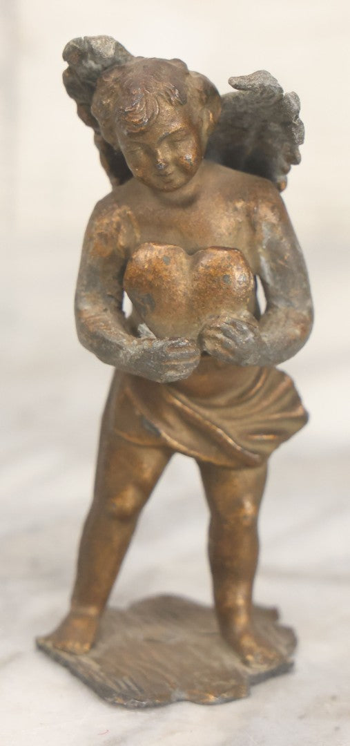 Lot 021 - Antique Pot Metal Valentines Cupid Figurine With Wings, Holding Heart, With Original Gold Paint