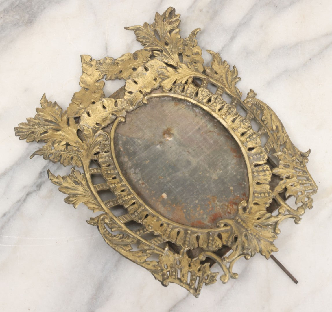 Lot 023 - Antique Ornate Brass Toned Metal Cabinet Card Sized Photo Frame With Leaf Motif, Kickstand, Note Small Losses, Soft Metal