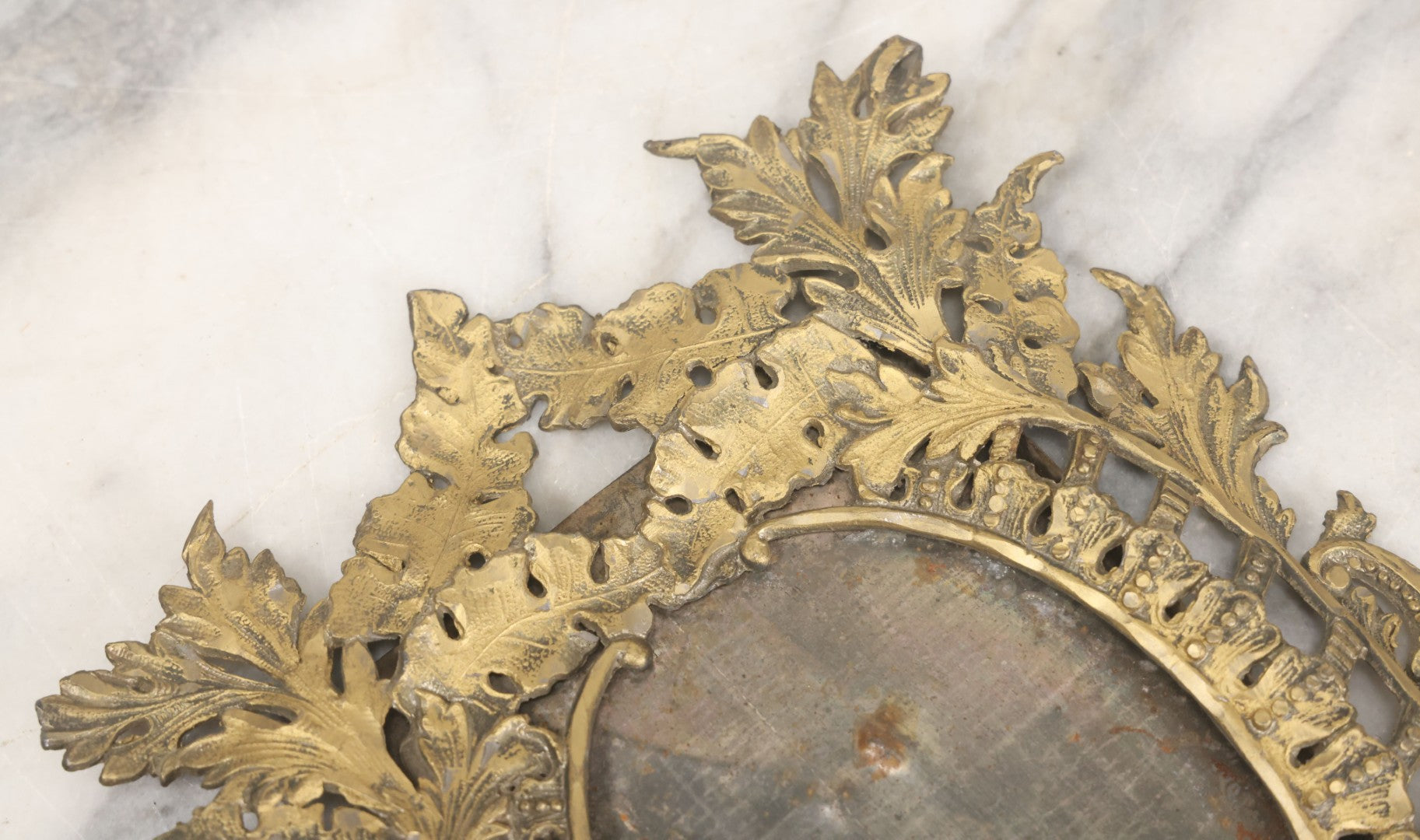 Lot 023 - Antique Ornate Brass Toned Metal Cabinet Card Sized Photo Frame With Leaf Motif, Kickstand, Note Small Losses, Soft Metal