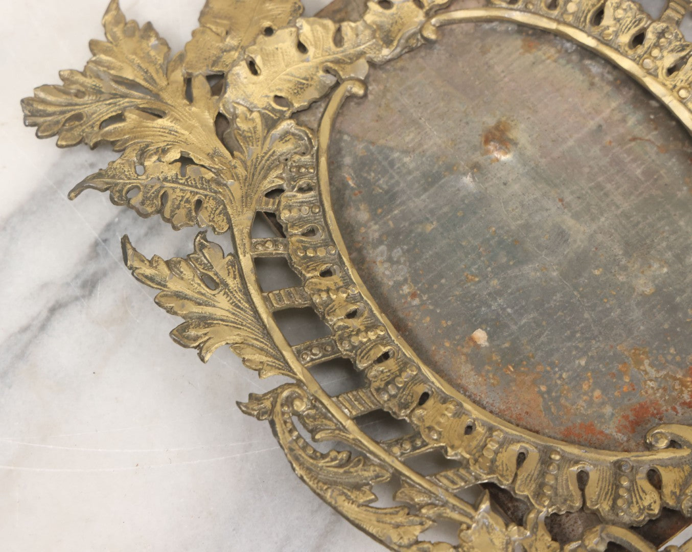 Lot 023 - Antique Ornate Brass Toned Metal Cabinet Card Sized Photo Frame With Leaf Motif, Kickstand, Note Small Losses, Soft Metal