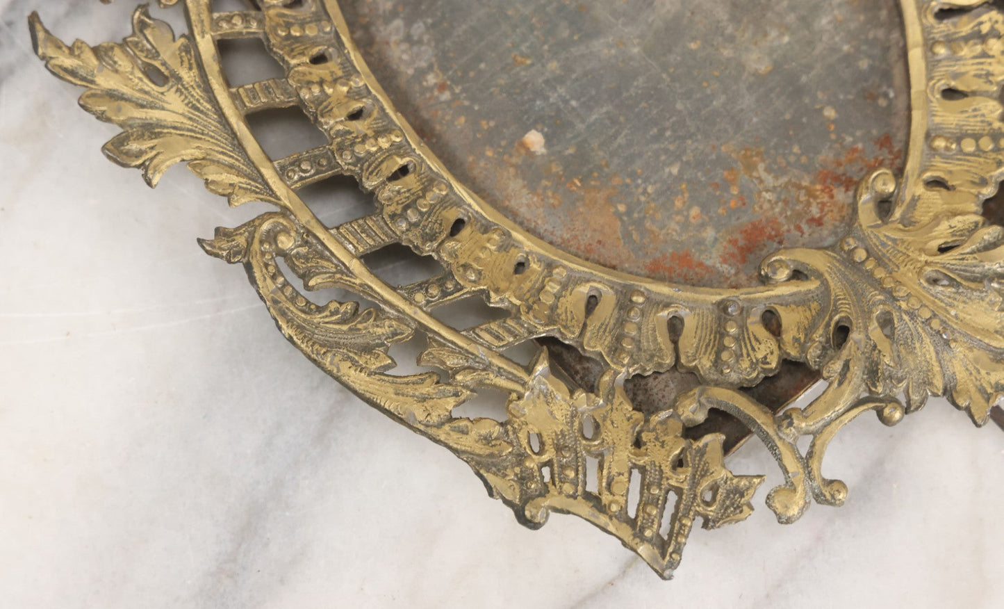 Lot 023 - Antique Ornate Brass Toned Metal Cabinet Card Sized Photo Frame With Leaf Motif, Kickstand, Note Small Losses, Soft Metal