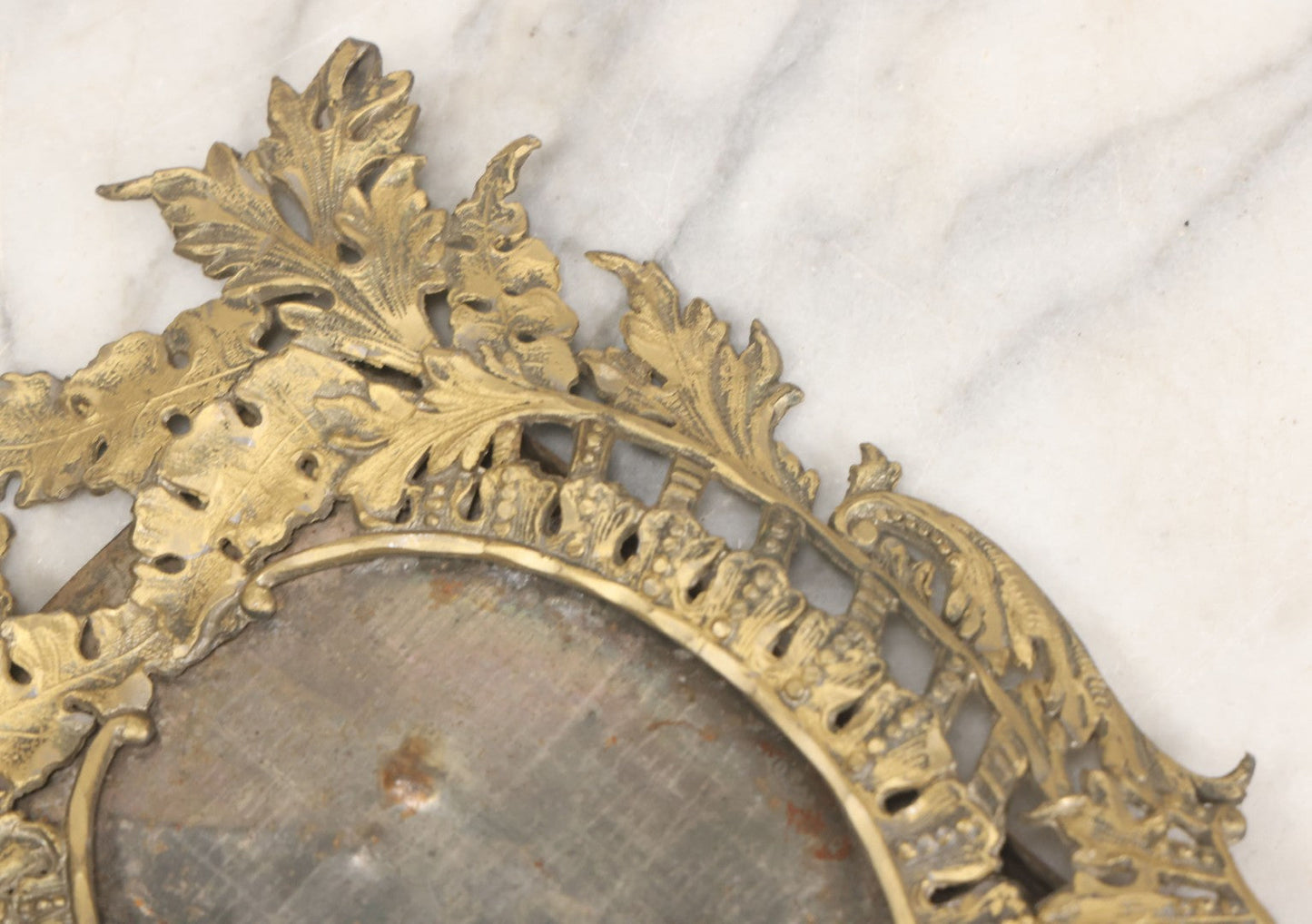 Lot 023 - Antique Ornate Brass Toned Metal Cabinet Card Sized Photo Frame With Leaf Motif, Kickstand, Note Small Losses, Soft Metal