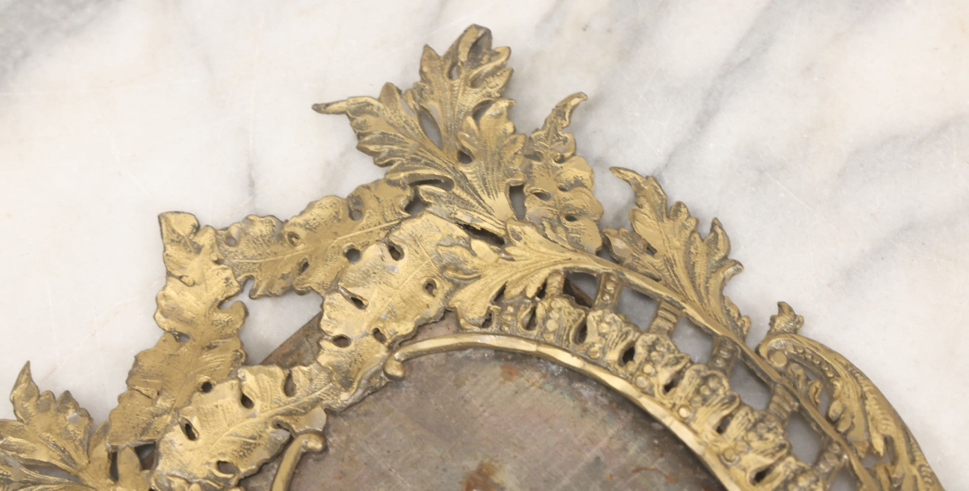 Lot 023 - Antique Ornate Brass Toned Metal Cabinet Card Sized Photo Frame With Leaf Motif, Kickstand, Note Small Losses, Soft Metal