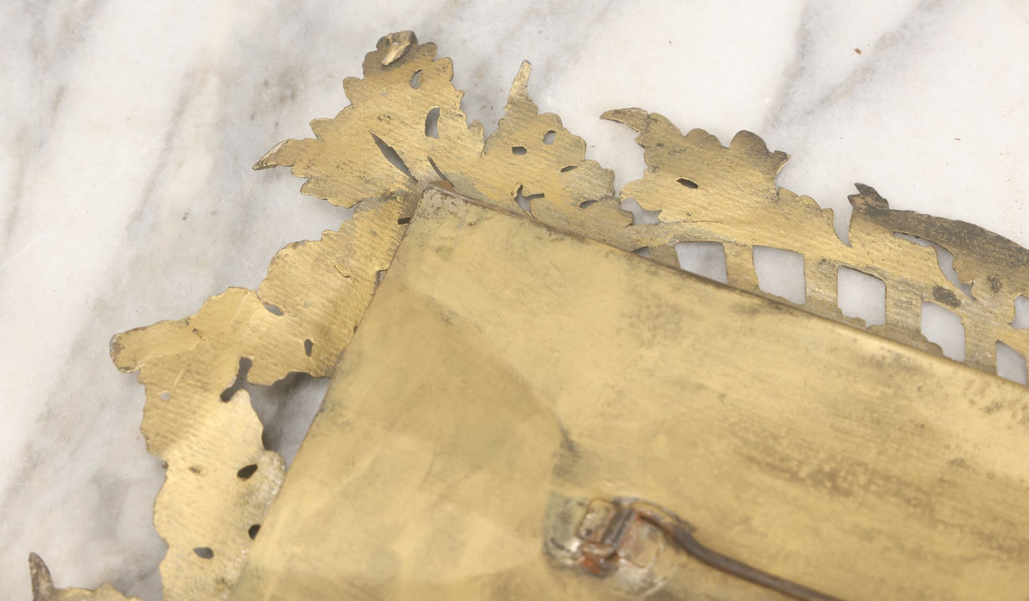 Lot 023 - Antique Ornate Brass Toned Metal Cabinet Card Sized Photo Frame With Leaf Motif, Kickstand, Note Small Losses, Soft Metal