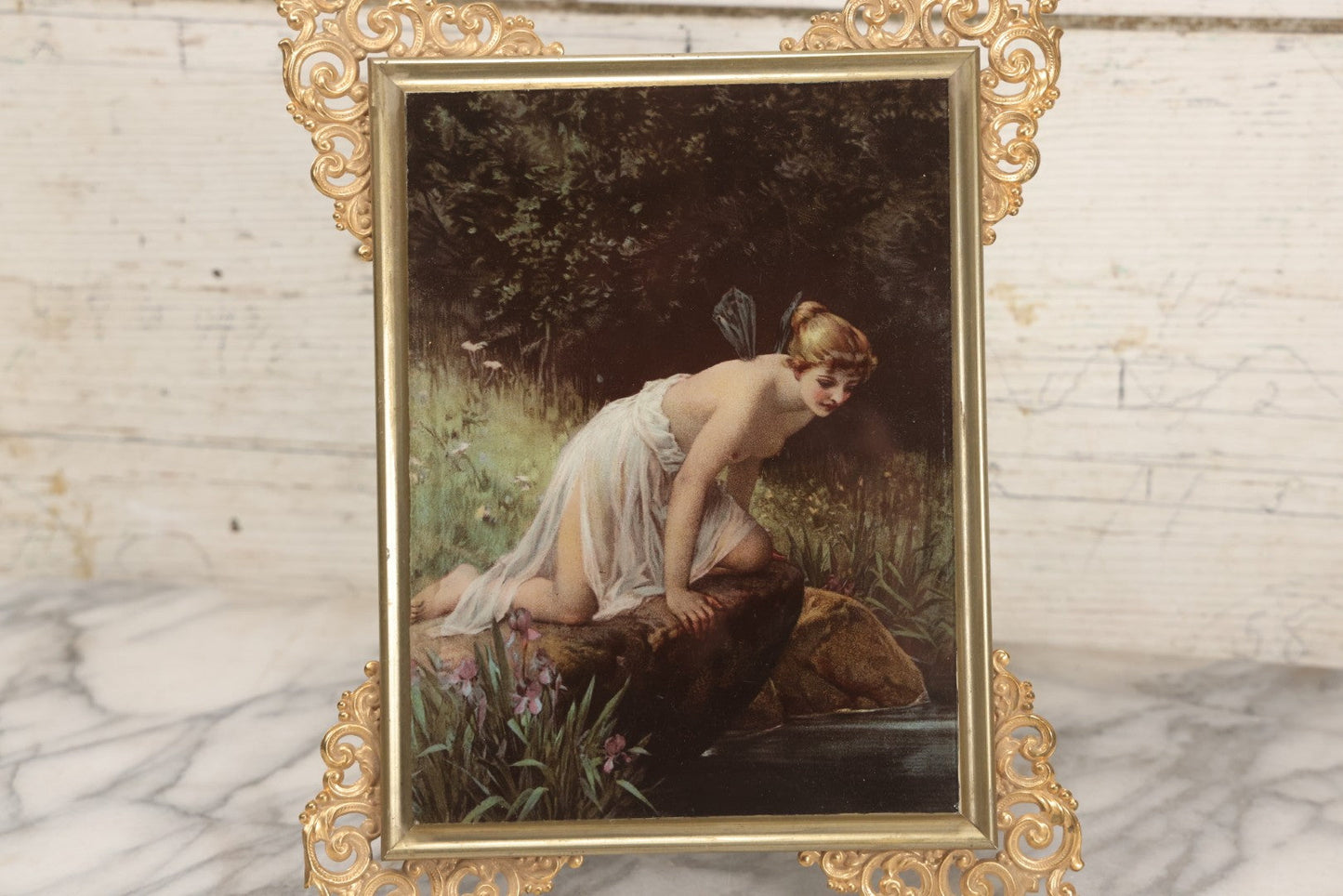 Lot 029 - Antique Glass Mounted Print Of Nude Fairy, After Paul Thumann's "Psyche" With Metal Frame Adornments And Kickstand, 8-1/2" x 10-1/2"