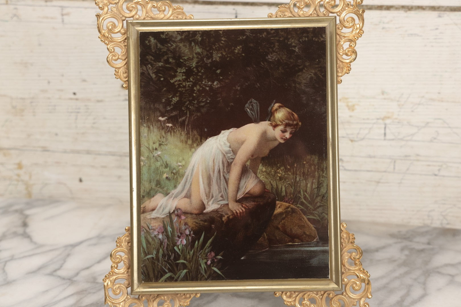 Lot 029 - Antique Glass Mounted Print Of Nude Fairy, After Paul Thumann's "Psyche" With Metal Frame Adornments And Kickstand, 8-1/2" x 10-1/2"