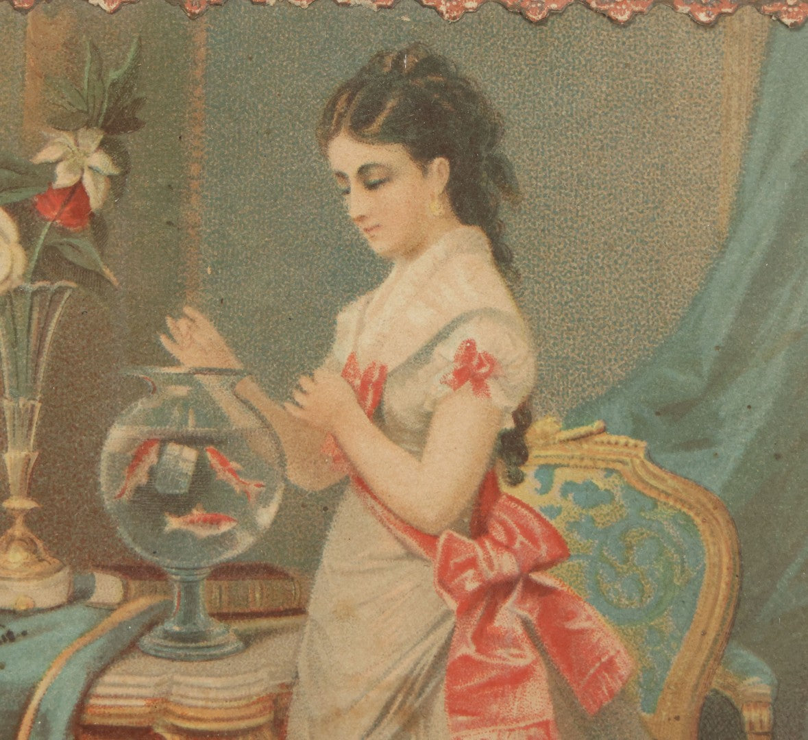 Lot 032 - Antique Lithographed Paper Board Box Cover Depicting Young Woman In Pink Dress Playing With Her Goldfish In Period Etched Wooden Frame, 10-5/8" x 11-3/4"