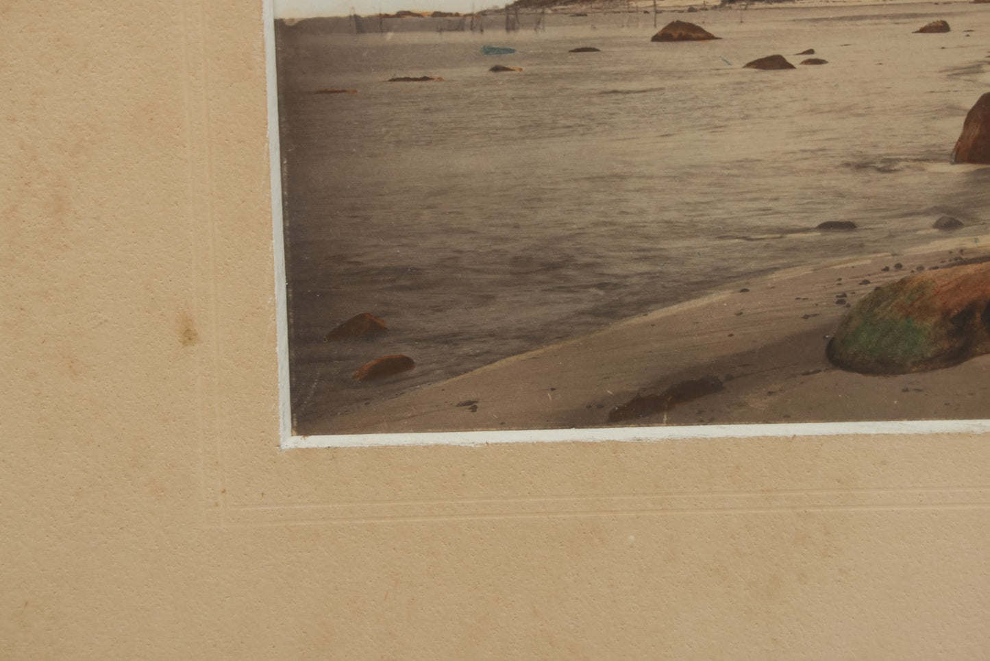 Lot 033 - Antique Painted Over Photograph Of Oceanside Cliffs And Beach With Child Seated On Rocks Likely Gay Head Cliffs, Martha's Vineyard, Massachusetts, In Original Frame, 17-1/2" x 15-1/2"
