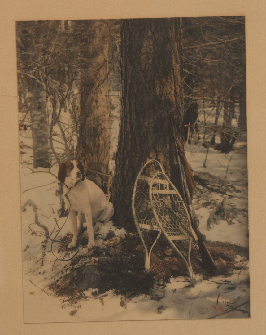 Lot 034 - Antique Hand Tinted Hunting Photograph With Hunting Dog Snowshoes And Rifle, Signed In Pencil Lower Left Homes "The Studio," Chocorua, New Hampshire, In Original Frame, 12-1/2" x 14-1/2"