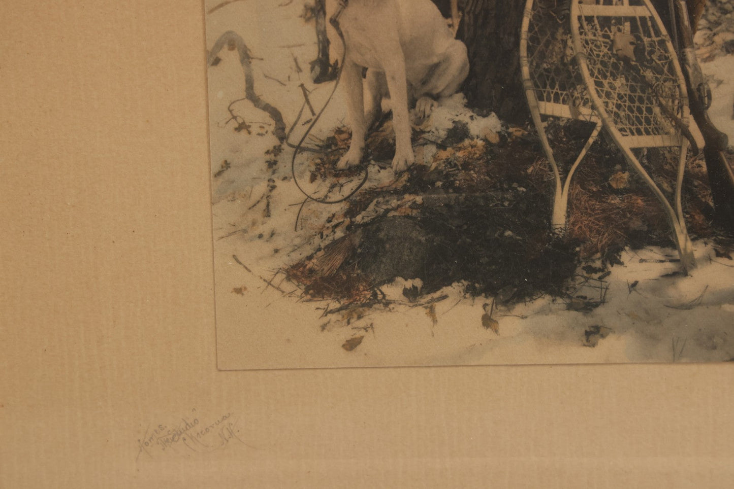 Lot 034 - Antique Hand Tinted Hunting Photograph With Hunting Dog Snowshoes And Rifle, Signed In Pencil Lower Left Homes "The Studio," Chocorua, New Hampshire, In Original Frame, 12-1/2" x 14-1/2"