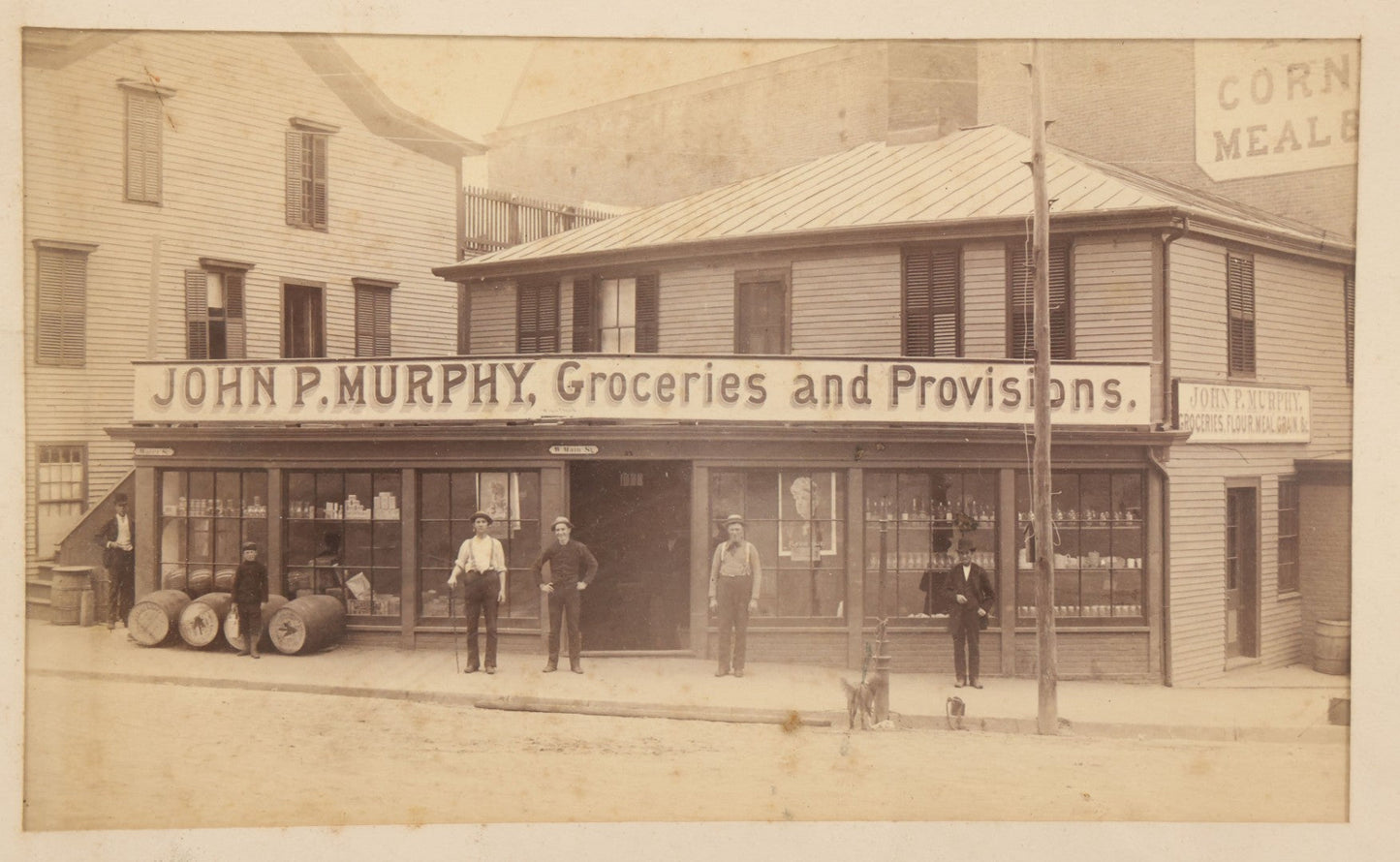 Lot 035 - Antique Occupational Photograph Depicting The Proprietors And Workers Of John P. Murphy Groceries And Provisions General Store, Located On West Main Street, Unknown City, Dog Visible In Photograph, In Period Frame, As Found, 11-1/2" x 8-1/2"