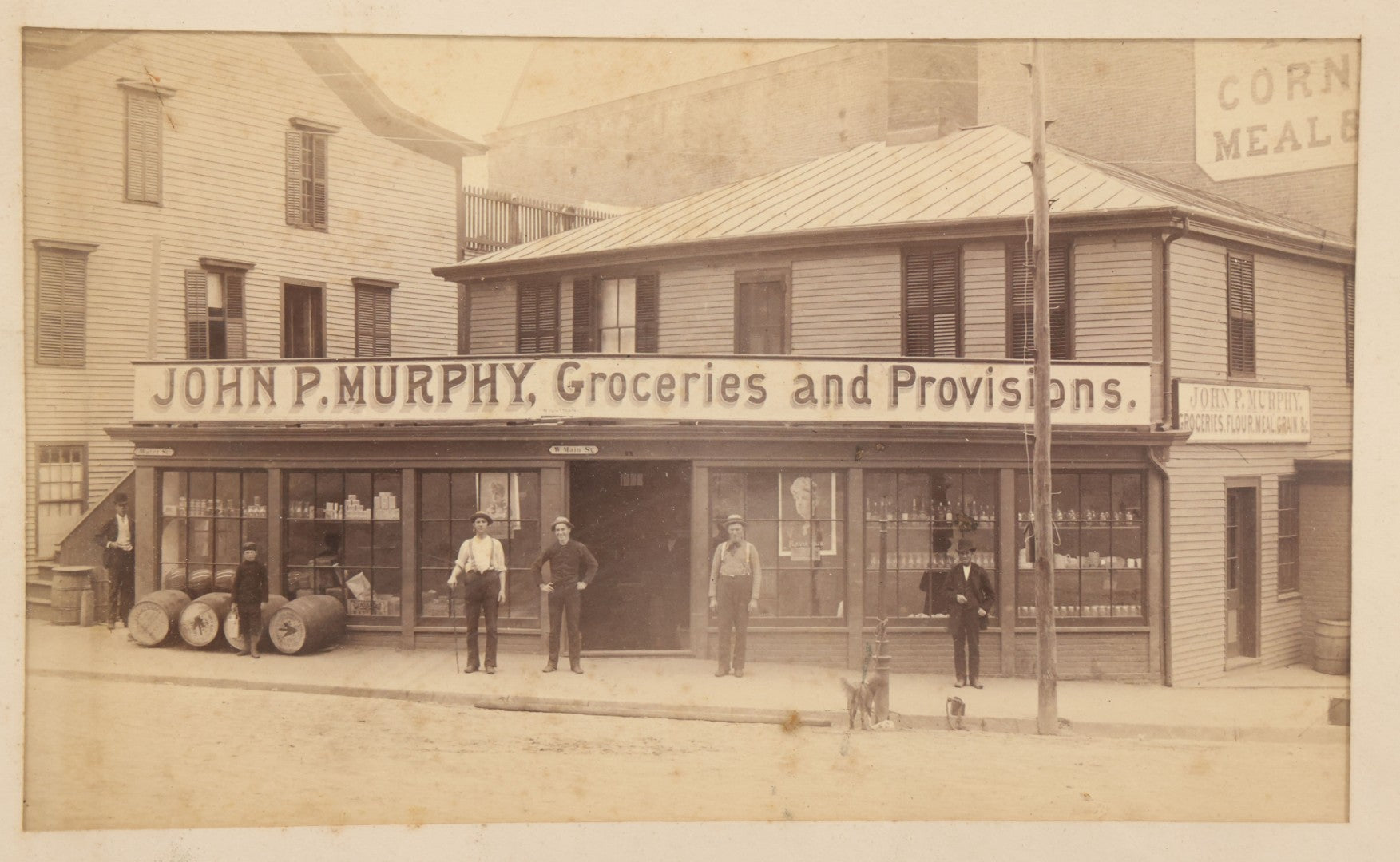 Lot 035 - Antique Occupational Photograph Depicting The Proprietors And Workers Of John P. Murphy Groceries And Provisions General Store, Located On West Main Street, Unknown City, Dog Visible In Photograph, In Period Frame, As Found, 11-1/2" x 8-1/2"