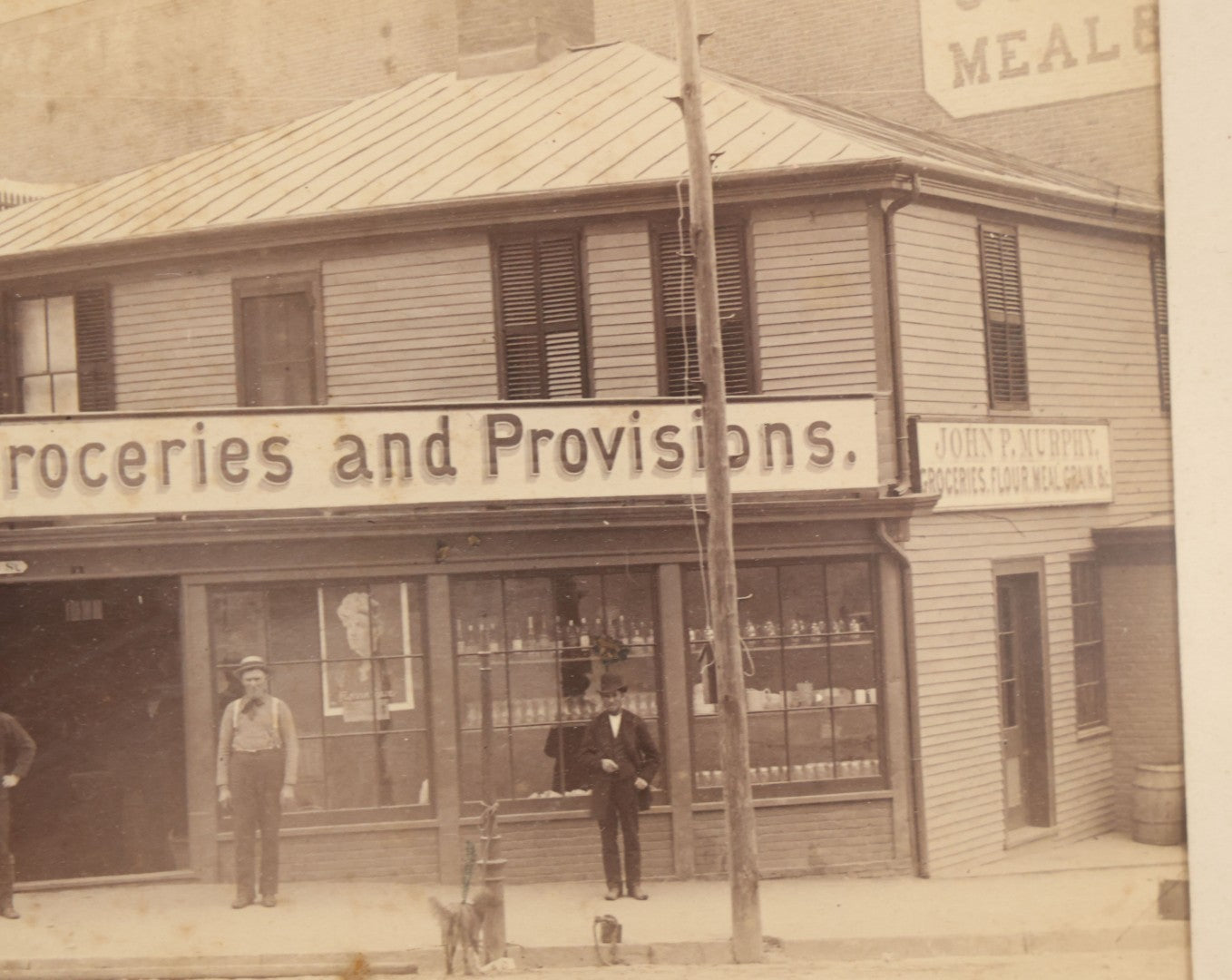 Lot 035 - Antique Occupational Photograph Depicting The Proprietors And Workers Of John P. Murphy Groceries And Provisions General Store, Located On West Main Street, Unknown City, Dog Visible In Photograph, In Period Frame, As Found, 11-1/2" x 8-1/2"