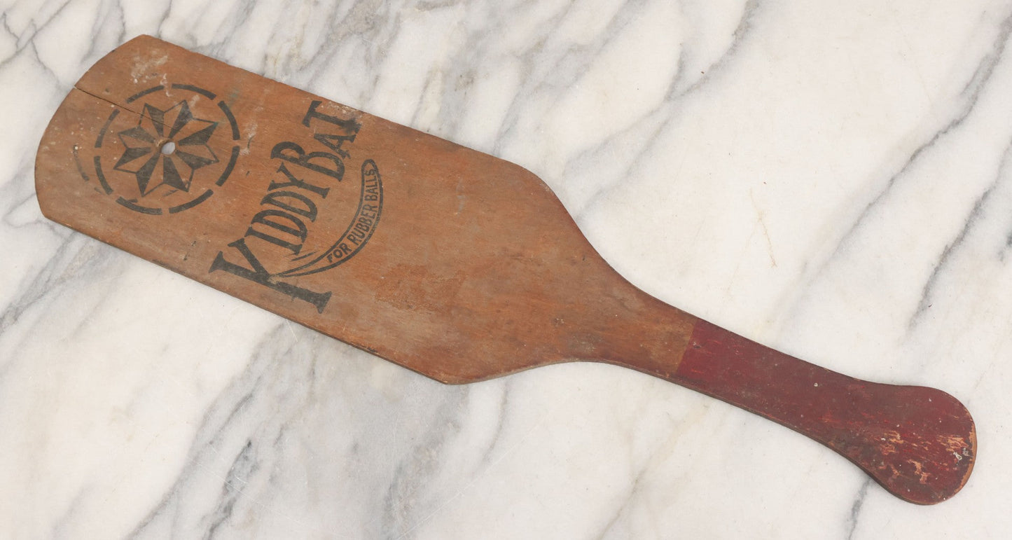 Lot 041 - Antique Wooden "Kiddy Bat" Game Paddle For Rubber Balls With Eight Pointed Star Geometric Design, Original Red Painted Handle, Note Vertical Crack At Top