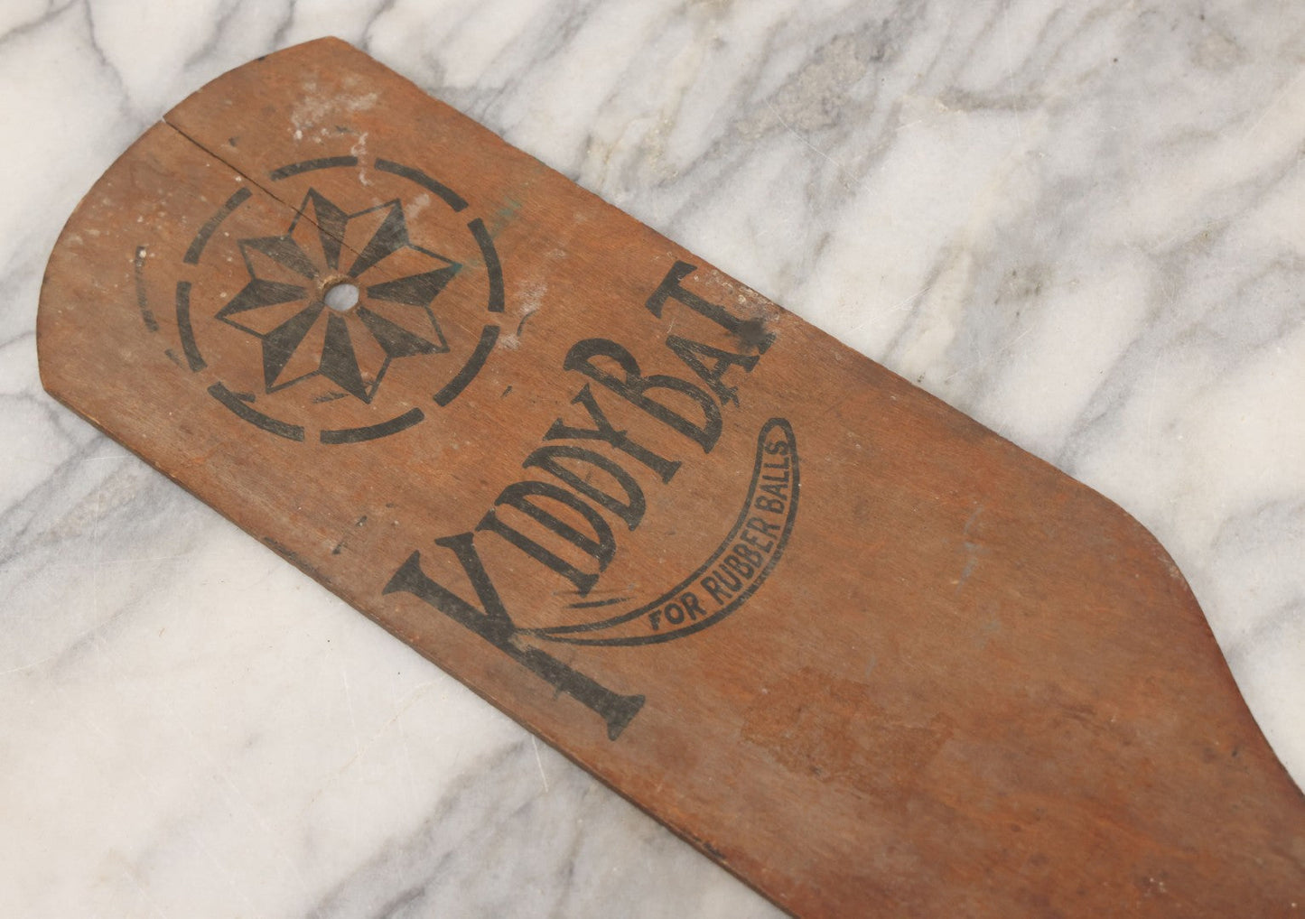Lot 041 - Antique Wooden "Kiddy Bat" Game Paddle For Rubber Balls With Eight Pointed Star Geometric Design, Original Red Painted Handle, Note Vertical Crack At Top