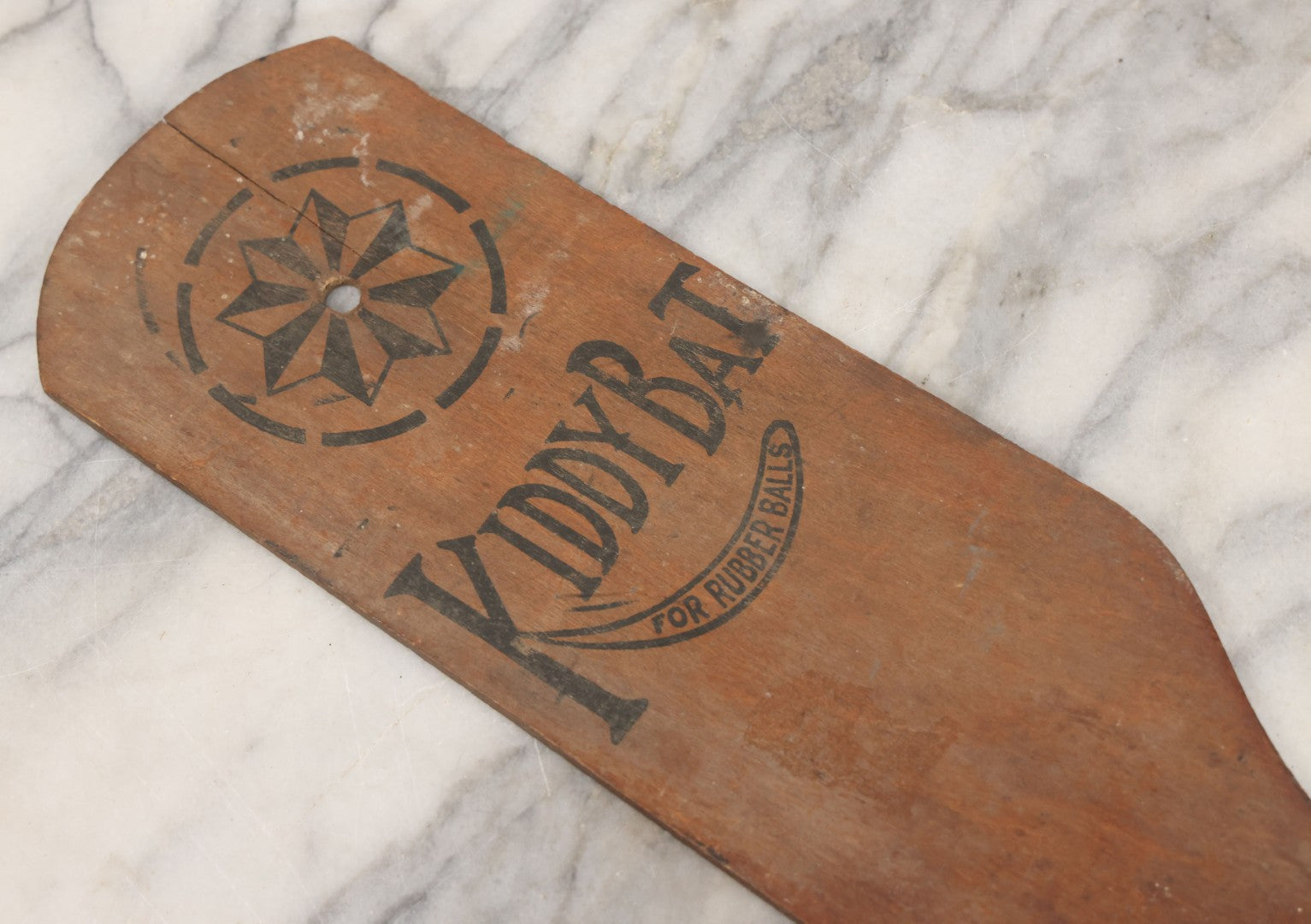 Lot 041 - Antique Wooden "Kiddy Bat" Game Paddle For Rubber Balls With Eight Pointed Star Geometric Design, Original Red Painted Handle, Note Vertical Crack At Top