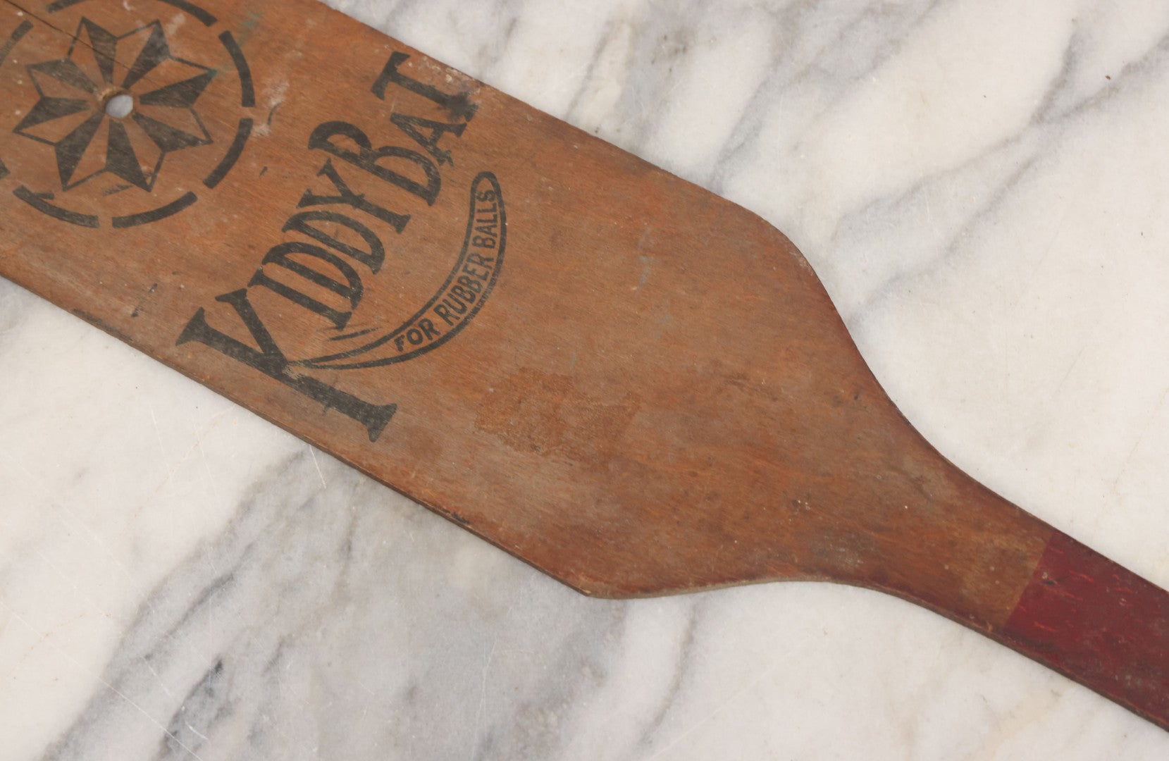 Lot 041 - Antique Wooden "Kiddy Bat" Game Paddle For Rubber Balls With Eight Pointed Star Geometric Design, Original Red Painted Handle, Note Vertical Crack At Top