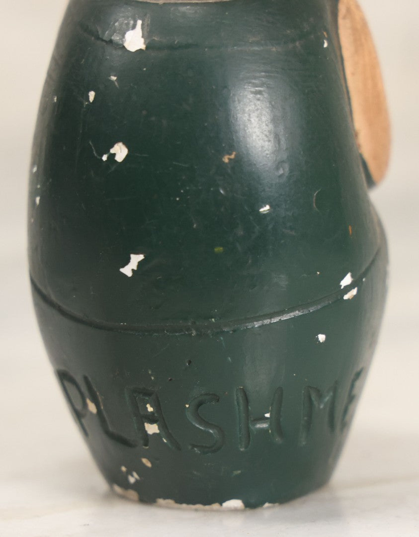 Lot 044 - Vintage Chalkware Kewpie-Style Crouching Flapper Doll With Black Hair And Green Dress, Back Marked "Splash Me", Note Paint Chipping And Wear, 4-3/4" Height