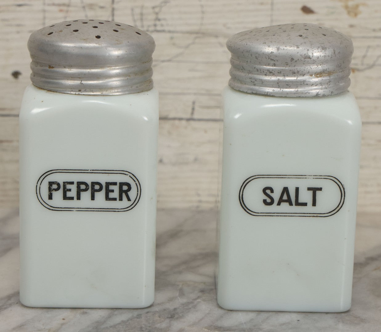 Lot 048 - Vintage Mid Century Milk Glass Salt And Pepper Shakers With Tin Lids And Black Lettering, 4-7/8" Height Each