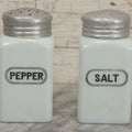 Lot 048 - Vintage Mid Century Milk Glass Salt And Pepper Shakers With Tin Lids And Black Lettering, 4-7/8" Height Each