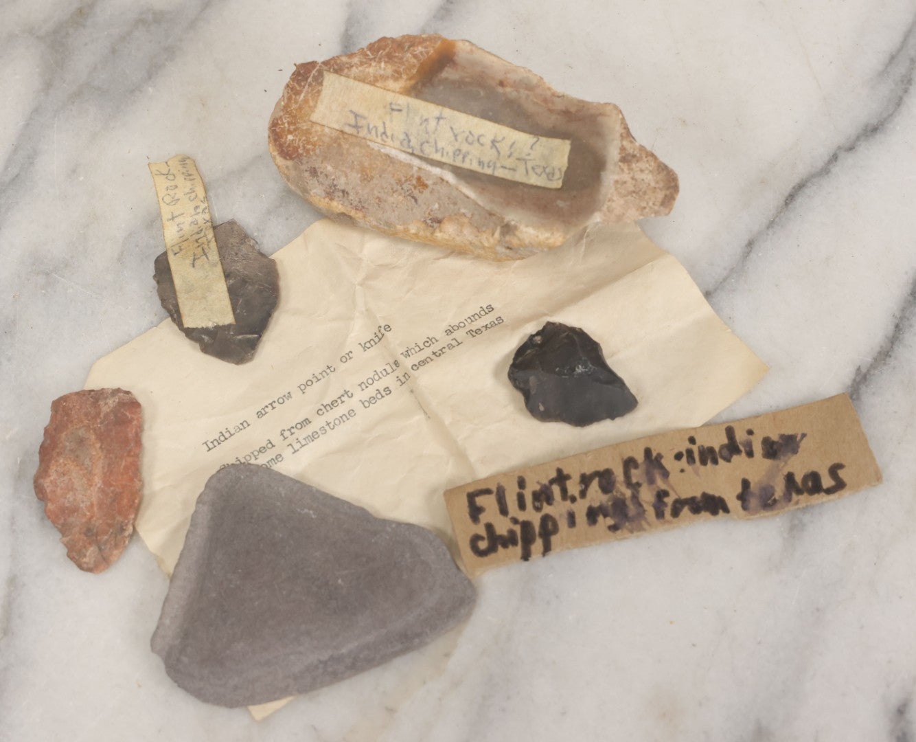 Lot 054 - Five Piece Grouping Of Indigenous Native American Indian Arrowheads And Tools With Handwritten And Typewritten Notations