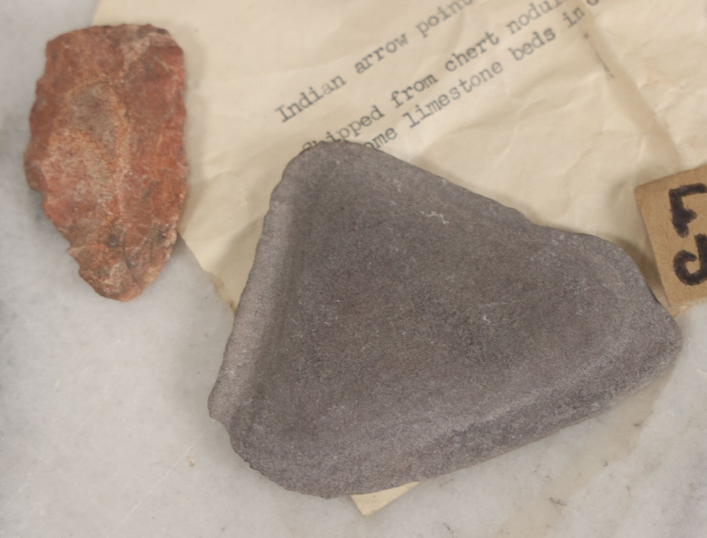 Lot 054 - Five Piece Grouping Of Indigenous Native American Indian Arrowheads And Tools With Handwritten And Typewritten Notations