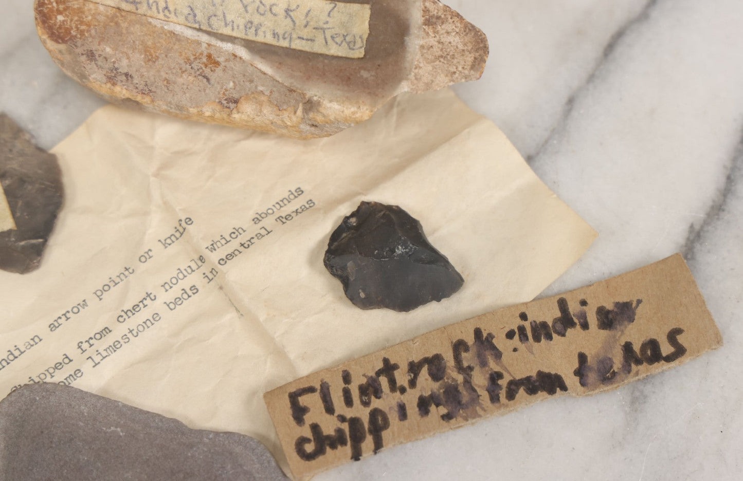 Lot 054 - Five Piece Grouping Of Indigenous Native American Indian Arrowheads And Tools With Handwritten And Typewritten Notations