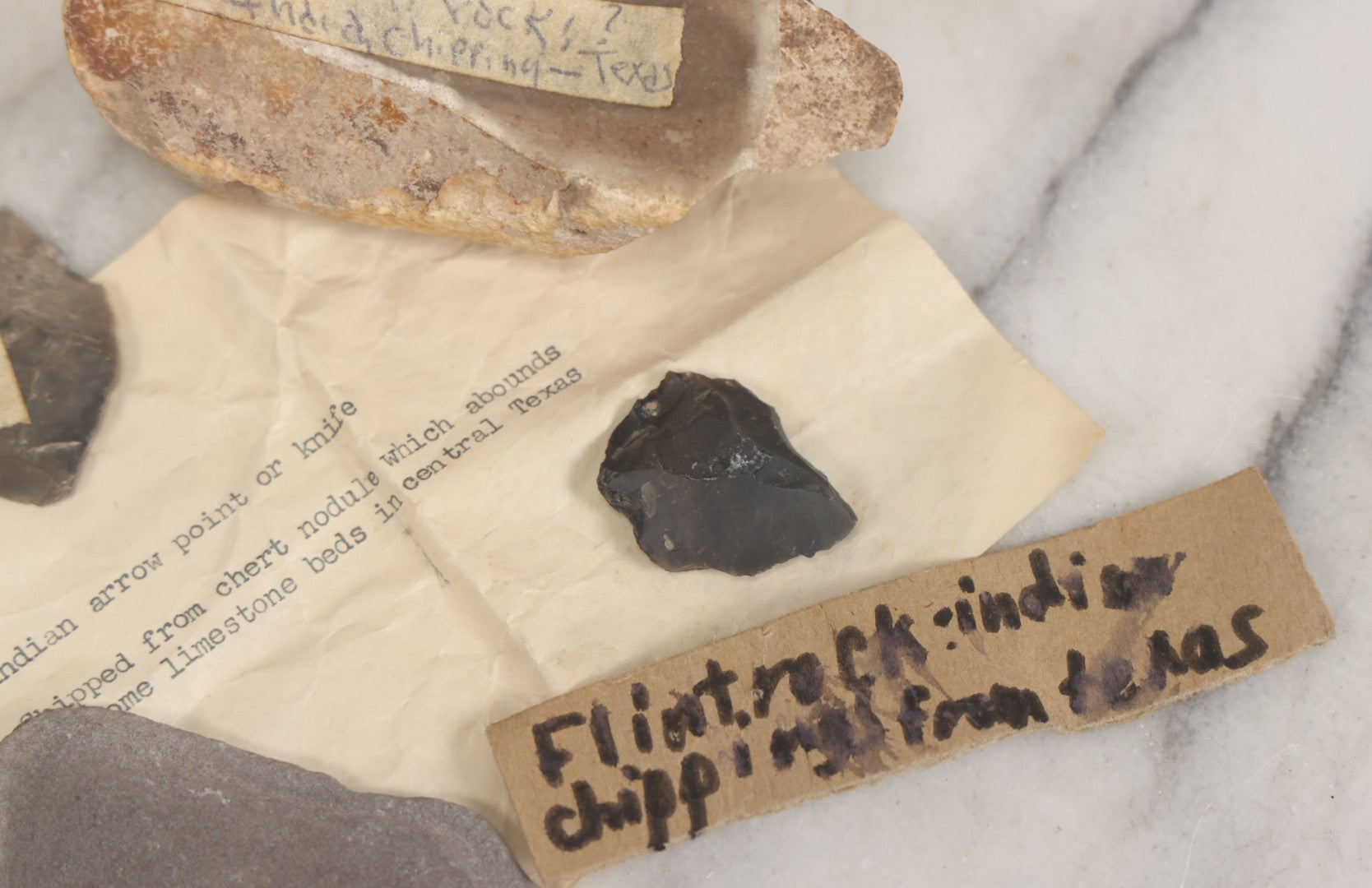 Lot 054 - Five Piece Grouping Of Indigenous Native American Indian Arrowheads And Tools With Handwritten And Typewritten Notations